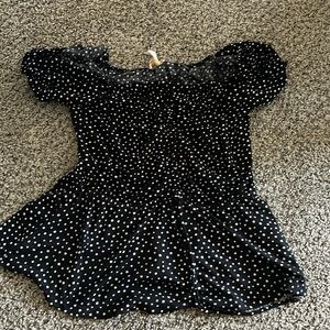 Polka dot t shirt with ruffles and a draw string around the waist